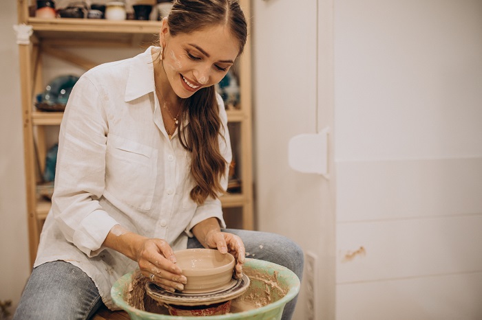 woman making pottery